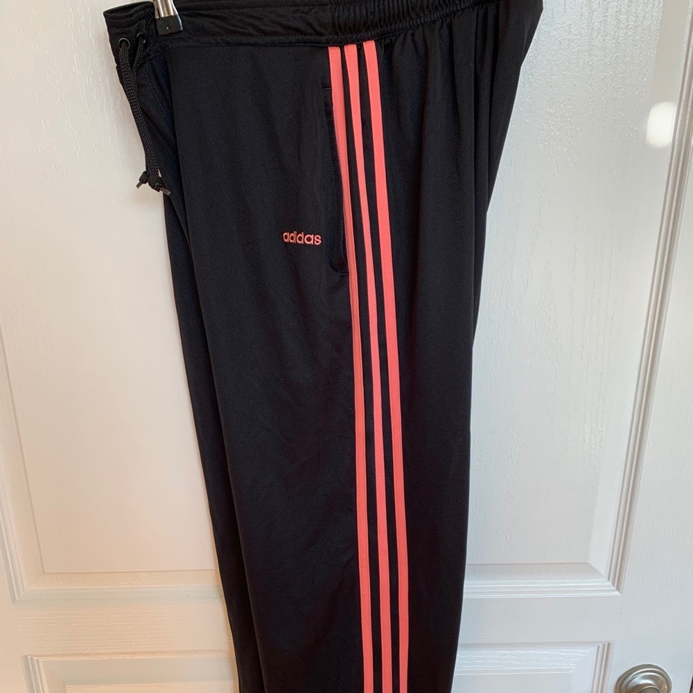 Black Adidas athletic pants with pink 3-stripes